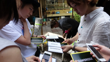 Group of young women looking at their cell phones