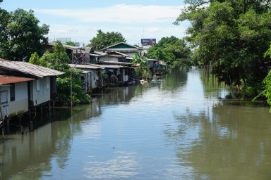 City view, river with houses on the riverside